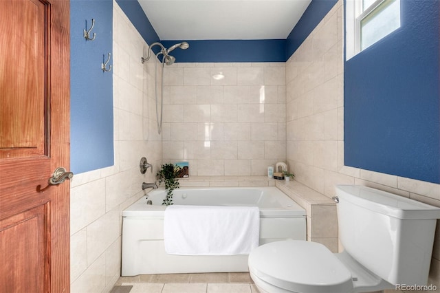 bathroom with tile walls, toilet, and tile patterned floors