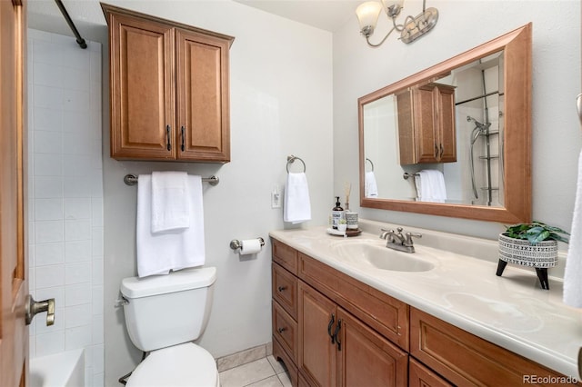 bathroom featuring tile patterned flooring, tub / shower combination, toilet, and vanity