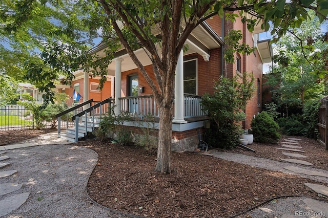 property entrance featuring a porch