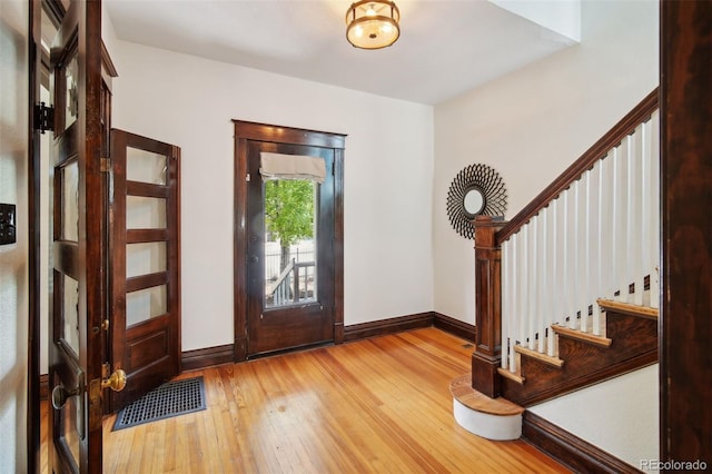 entryway featuring french doors and wood-type flooring