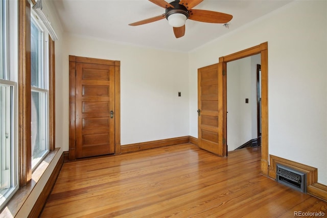 unfurnished room featuring ceiling fan and light wood-type flooring