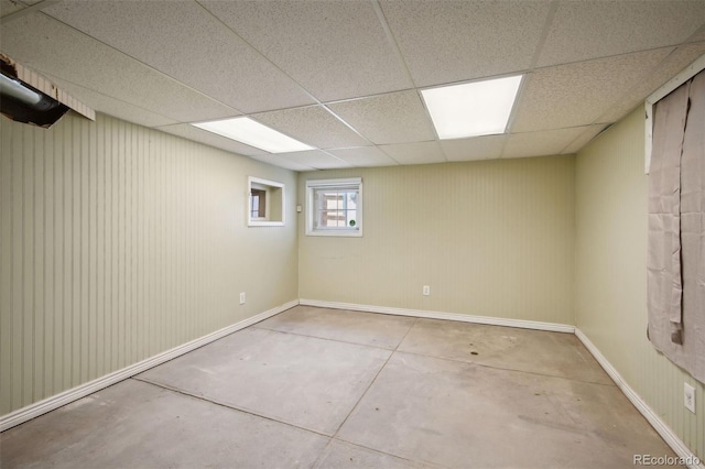 basement featuring a drop ceiling