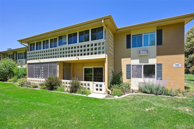740 S Alton Way Unit 2A, Denver, CO 80247 - back of house featuring a lawn