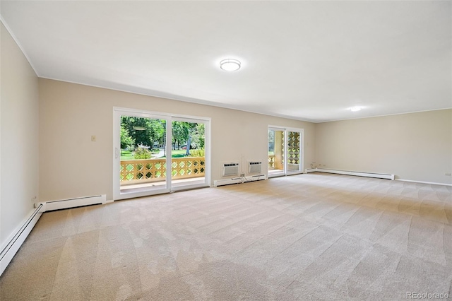 740 S Alton Way Unit 2A, Denver, CO 80247 - unfurnished room featuring a baseboard heating unit and carpet