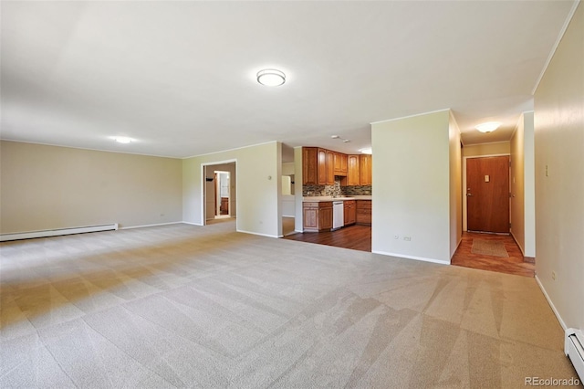 740 S Alton Way Unit 2A, Denver, CO 80247 - unfurnished living room featuring light carpet and baseboard heating