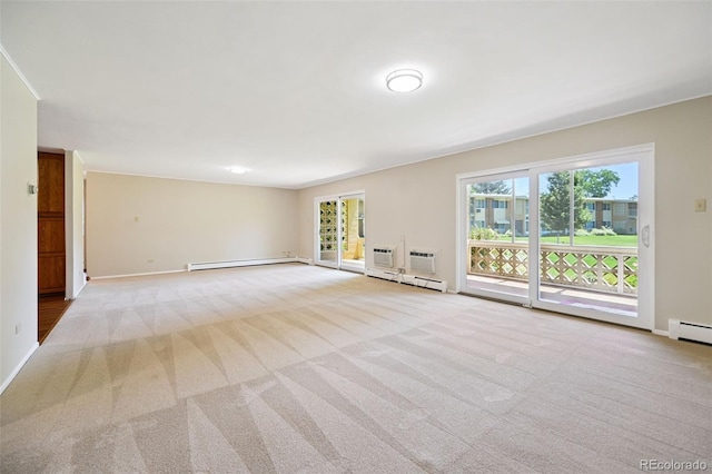 740 S Alton Way Unit 2A, Denver, CO 80247 - spare room with carpet flooring, a baseboard heating unit, a baseboard radiator, and a wall unit AC