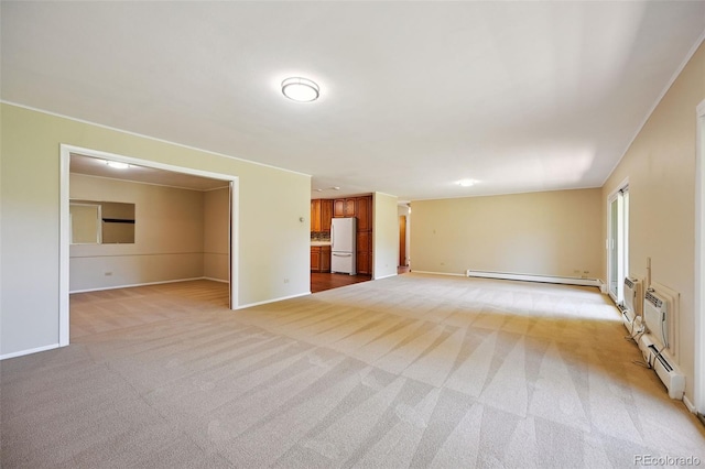 740 S Alton Way Unit 2A, Denver, CO 80247 - unfurnished living room featuring a baseboard heating unit and light colored carpet