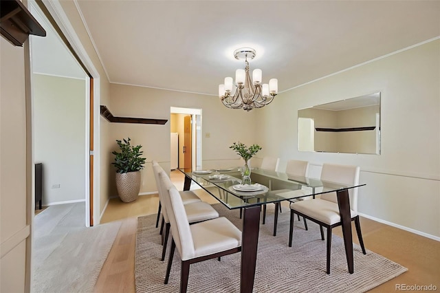740 S Alton Way Unit 2A, Denver, CO 80247 - dining area with a chandelier and crown molding