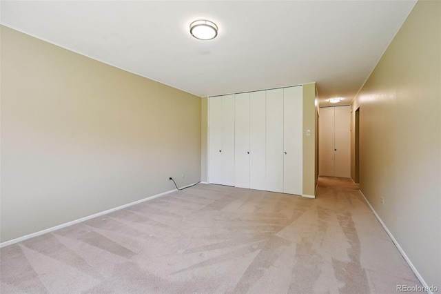740 S Alton Way Unit 2A, Denver, CO 80247 - unfurnished bedroom with light colored carpet and a closet