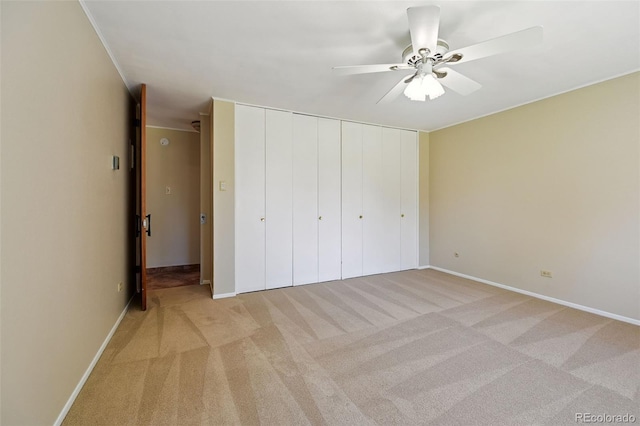 740 S Alton Way Unit 2A, Denver, CO 80247 - unfurnished bedroom with light carpet, a closet, and a ceiling fan