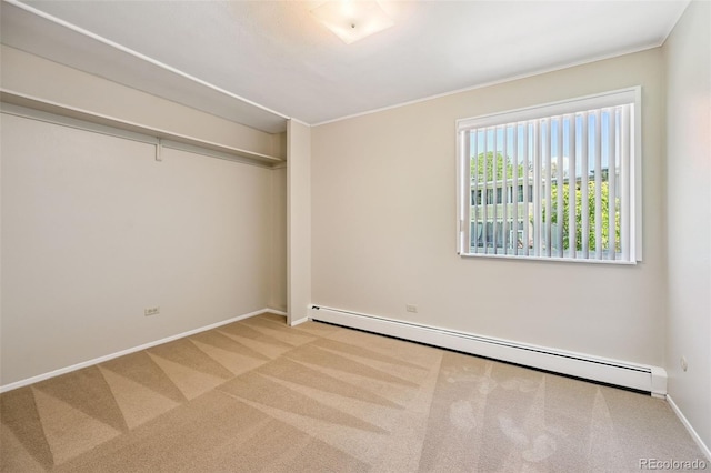 740 S Alton Way Unit 2A, Denver, CO 80247 - unfurnished bedroom with baseboard heating, carpet, and crown molding