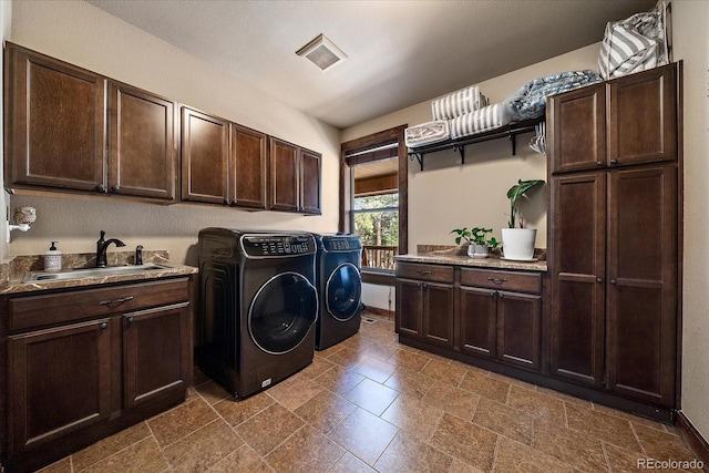 8090 S Homesteader Dr, Morrison, CO 80465 - washroom featuring cabinet space and separate washer and dryer