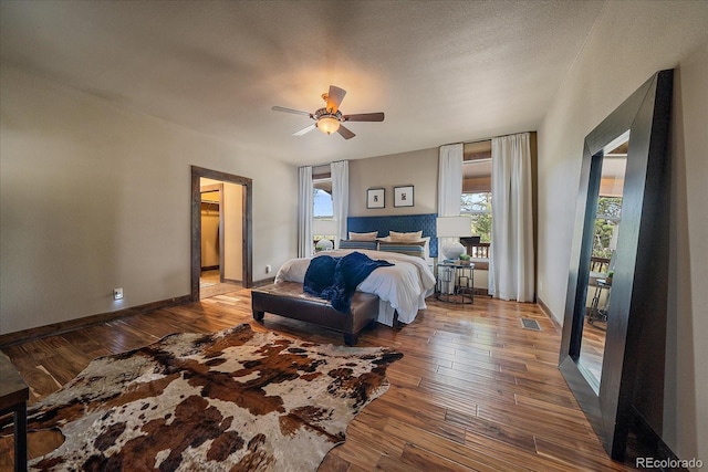 8090 S Homesteader Dr, Morrison, CO 80465 - bedroom featuring hardwood / wood-style flooring and ceiling fan