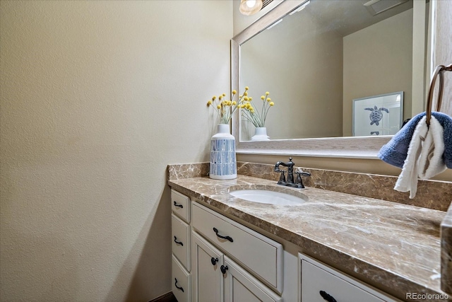 8090 S Homesteader Dr, Morrison, CO 80465 - bathroom with vanity and a textured wall