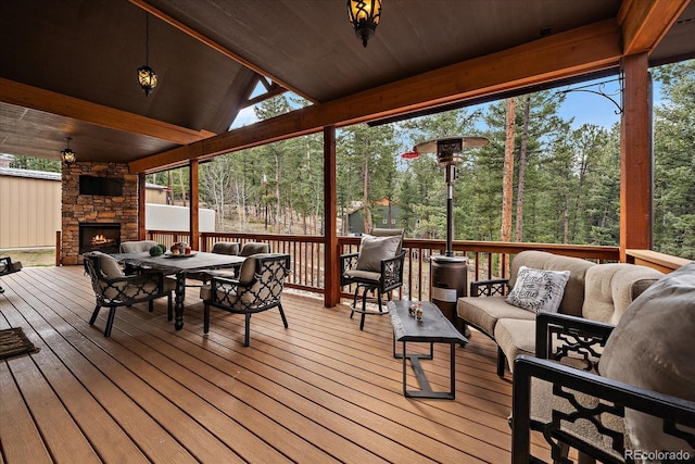 8090 S Homesteader Dr, Morrison, CO 80465 - deck featuring an outdoor living space with a fireplace