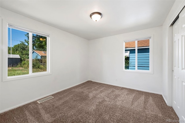 spare room featuring carpet floors