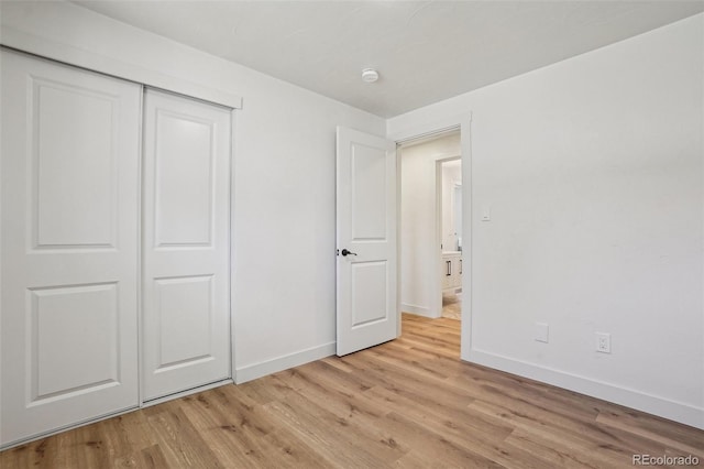 6068 Lee St, Arvada, CO 80004 - unfurnished bedroom featuring baseboards, light wood-style floors, and a closet