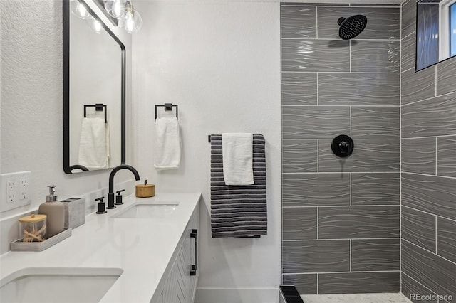 6068 Lee St, Arvada, CO 80004 - bathroom featuring double vanity and tiled shower