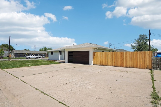 6068 Lee St, Arvada, CO 80004 - view of side of property featuring a garage and concrete driveway