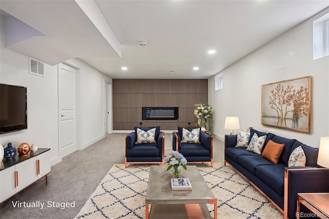 6068 Lee St, Arvada, CO 80004 - living area with recessed lighting, carpet, baseboards, and an accent wall