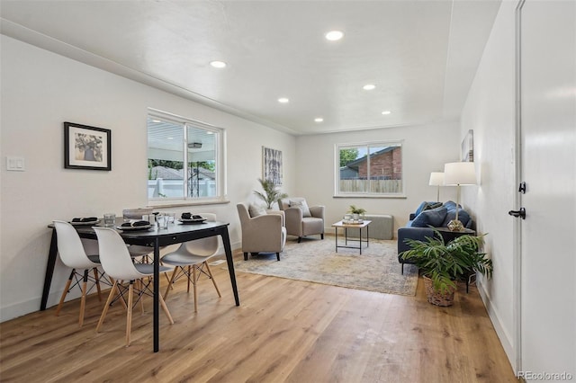 6068 Lee St, Arvada, CO 80004 - dining area featuring wood finished floors, baseboards, and recessed lighting