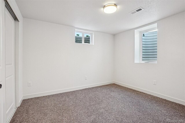 6068 Lee St, Arvada, CO 80004 - below grade area featuring carpet and baseboards