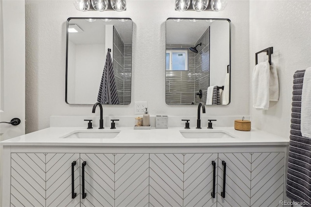 6068 Lee St, Arvada, CO 80004 - bathroom with double vanity and a textured wall