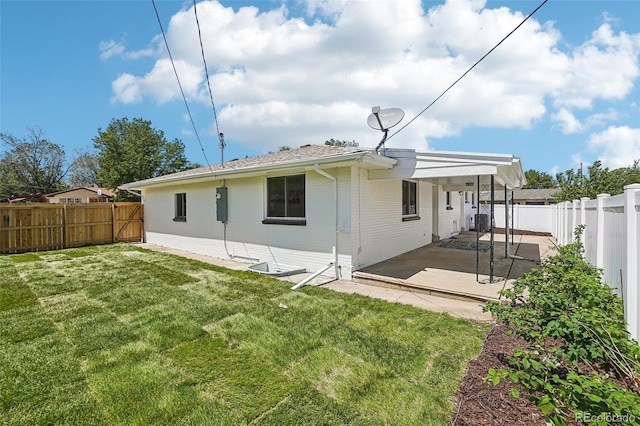 6068 Lee St, Arvada, CO 80004 - back of house featuring a patio, central AC, and brick siding
