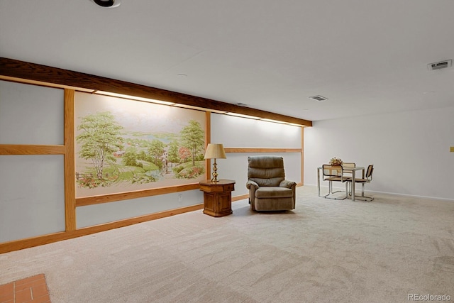 sitting room featuring carpet flooring