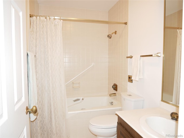 full bathroom featuring shower / bath combo, vanity, and toilet