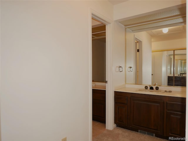 bathroom with vanity and tile patterned floors