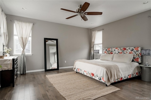bedroom featuring dark wood-type flooring, baseboards, a ceiling fan, and recessed lighting
