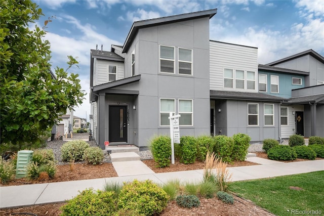 contemporary home featuring stucco siding