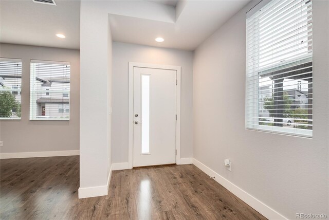 foyer entrance with baseboards, recessed lighting, and wood finished floors
