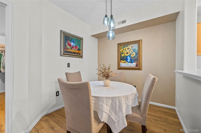 dining room with hardwood / wood-style floors