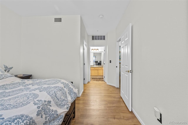 bedroom with hardwood / wood-style flooring