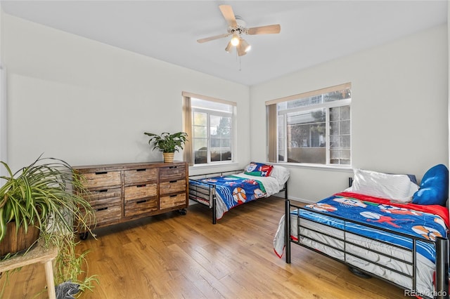 bedroom featuring hardwood / wood-style floors and ceiling fan