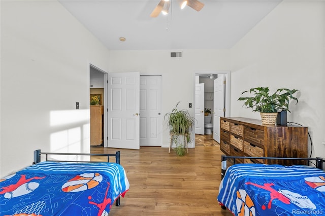 bedroom with a closet, ceiling fan, and hardwood / wood-style floors