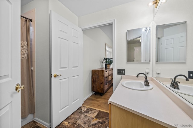 bathroom with vanity and walk in shower