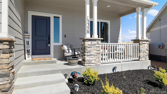 entrance to property featuring a porch