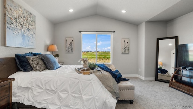 bedroom with light carpet and vaulted ceiling