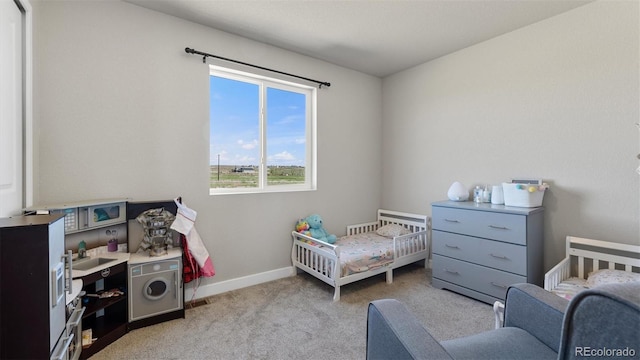 carpeted bedroom with a crib