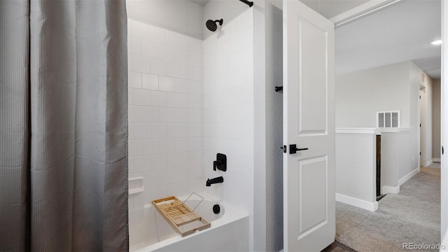 bathroom with shower / tub combo with curtain