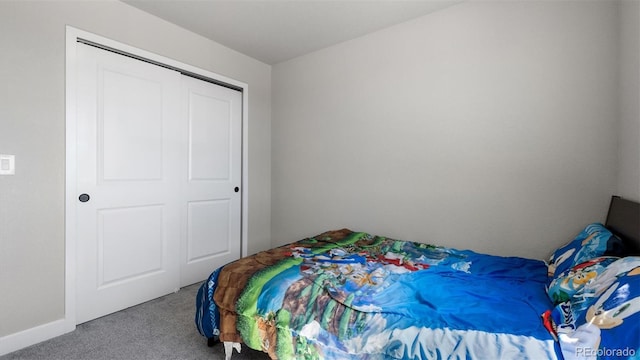 bedroom with carpet flooring and a closet