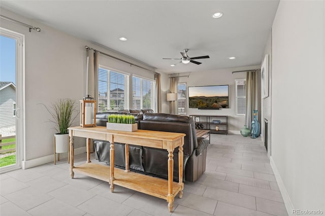 7380 S Shady Grove Way, Aurora, CO 80016 - living area with healthy amount of natural light, ceiling fan, baseboards, recessed lighting, and light tile patterned floors