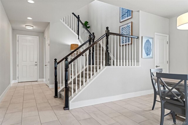 7380 S Shady Grove Way, Aurora, CO 80016 - staircase featuring baseboards, recessed lighting, and tile patterned floors