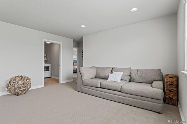7380 S Shady Grove Way, Aurora, CO 80016 - living room with light colored carpet, washer / dryer, baseboards, and recessed lighting