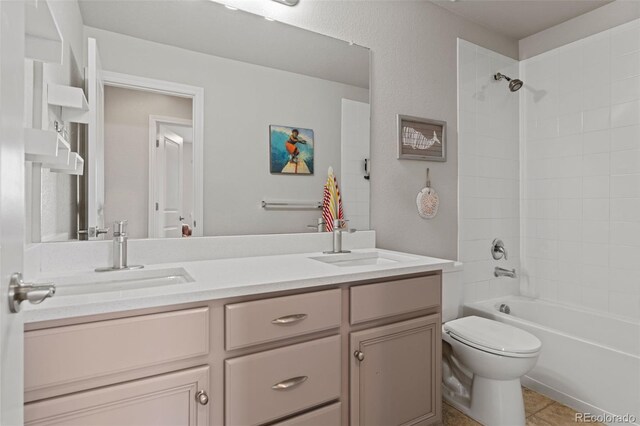 7380 S Shady Grove Way, Aurora, CO 80016 - full bath featuring double vanity, toilet, washtub / shower combination, and tile patterned floors
