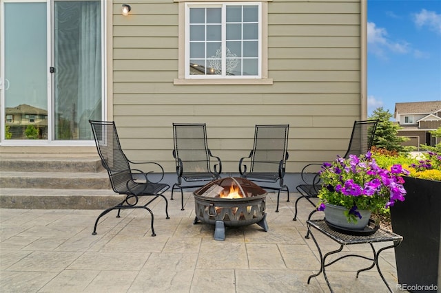 7380 S Shady Grove Way, Aurora, CO 80016 - view of patio / terrace with an outdoor fire pit and entry steps