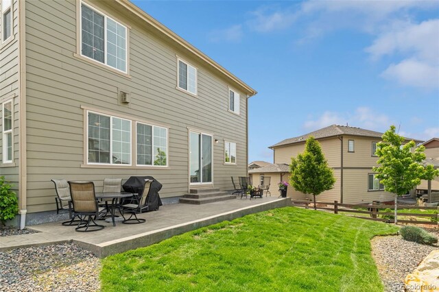 7380 S Shady Grove Way, Aurora, CO 80016 - rear view of house with entry steps and a patio area